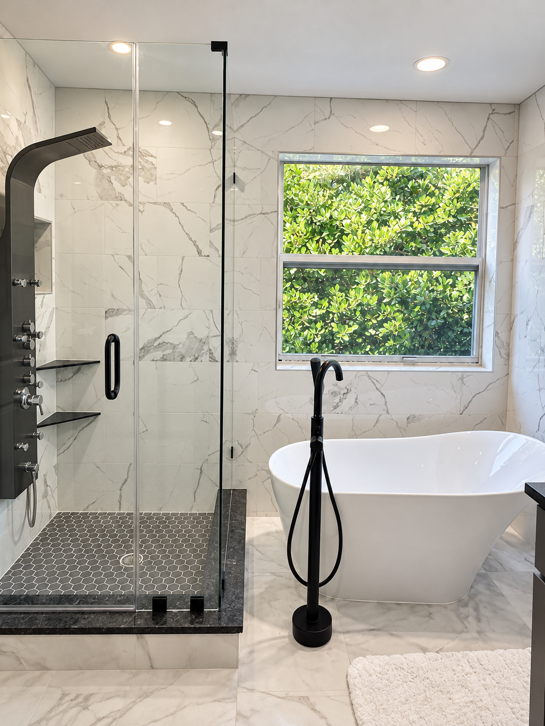 Marble-tiled bathroom with a glass shower, black fixtures, and a freestanding bathtub