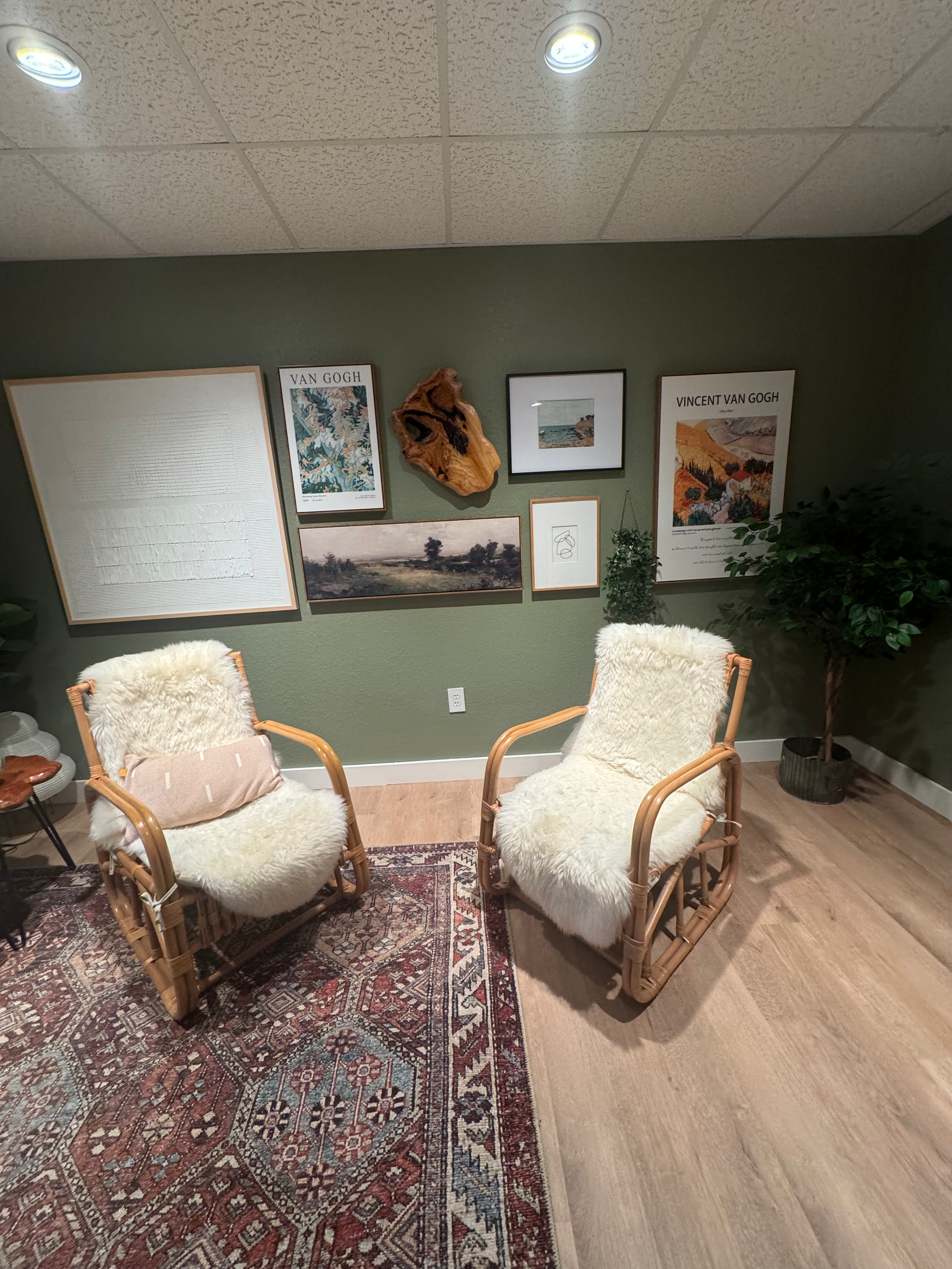 Two chairs and artwork inside Shira Hearn’s Webb City office