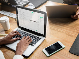 Woman checking her email on a laptop