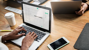 Woman checking her email on a laptop