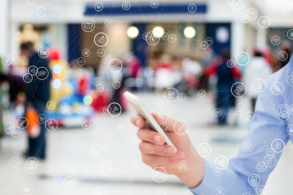 Hand holding a smartphone connecting with a digital customer in public.