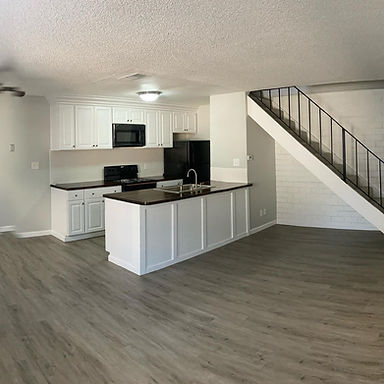After kitchen remodel. New flooring, cabinets, backsplash, and countertops. 