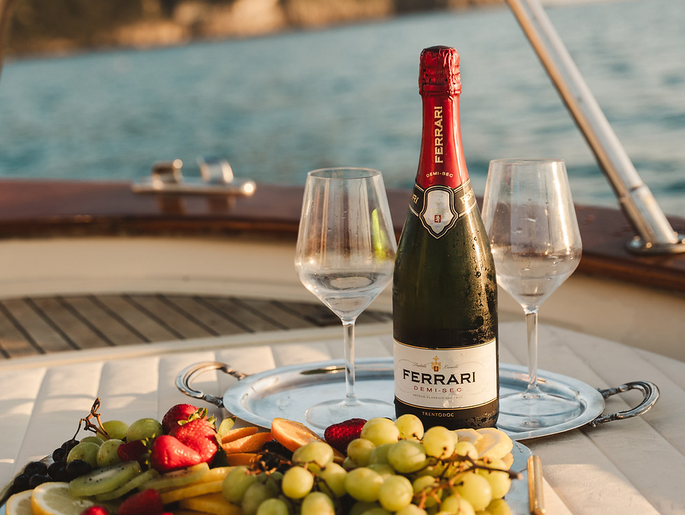 Champagne and fruit platter on an Ischia luxury charter.
