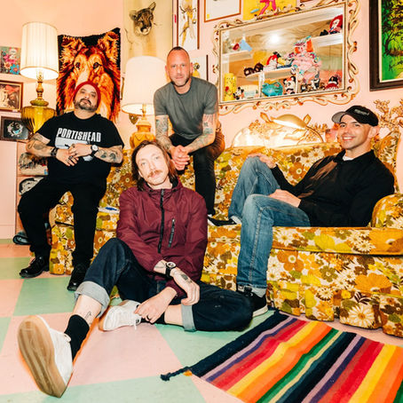 ME. band photo — Eddie Reyes, Mark O'Connell, Mike Jansen and Neal Amiruddin pose in a vintage room ahead of their debut album All Good Things.