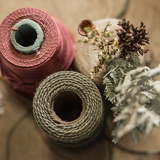 A selection of recycled fibres an nature in deep earthy