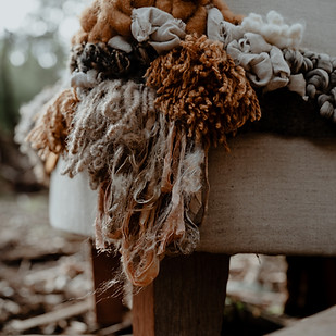 Latch hook detail of natural earthy tone fibres.