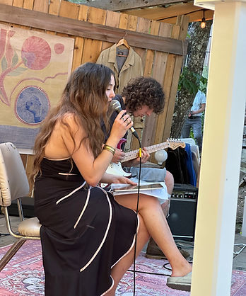 Imogen and Ethan playing and singing