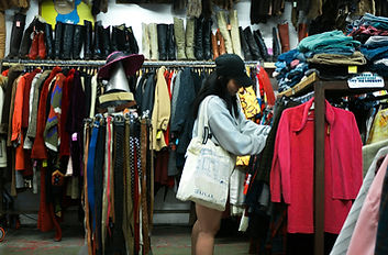 Woman browsing clothes at a thrift store._edited.jpg