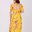 Thumbnail: Sunflower yellow hand-embroidered floral drape skirt with a matching choli