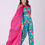Thumbnail: Floral embroidered turquoise co-ord set paired with a statement pink cape