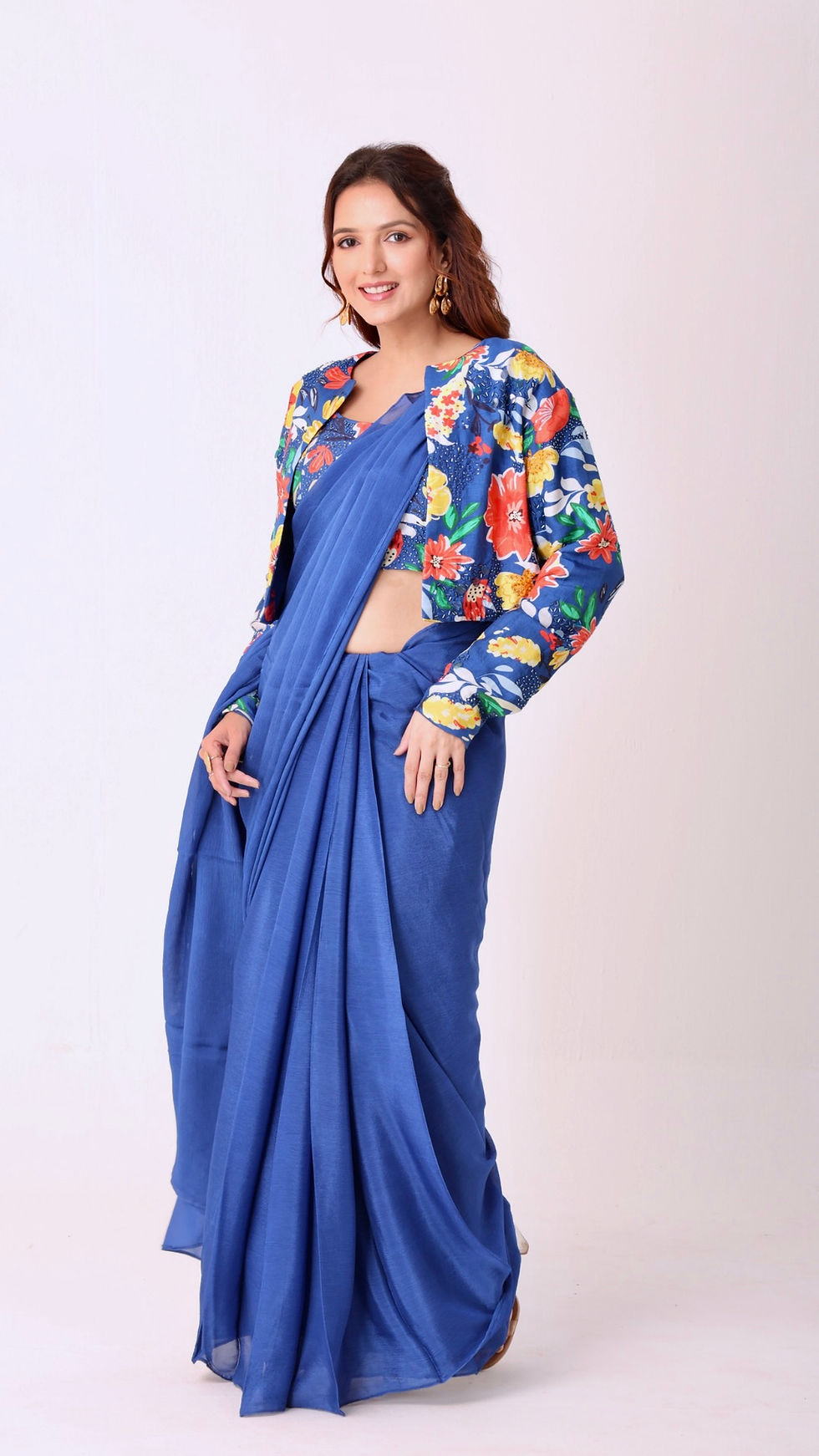 Thumbnail: Hand-embroidered blouse and jacket paired with a solid blue saree