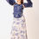 Thumbnail: Embroidered navy halter top with dramatic puff sleeve & floral flair ivory skirt