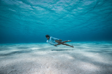 freediver in clear ocean water