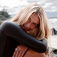 woman in wetsuit looking at camera