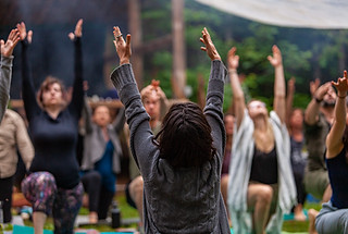 Diverse people enjoy spiritual gathering A large group of multigenerational people are see