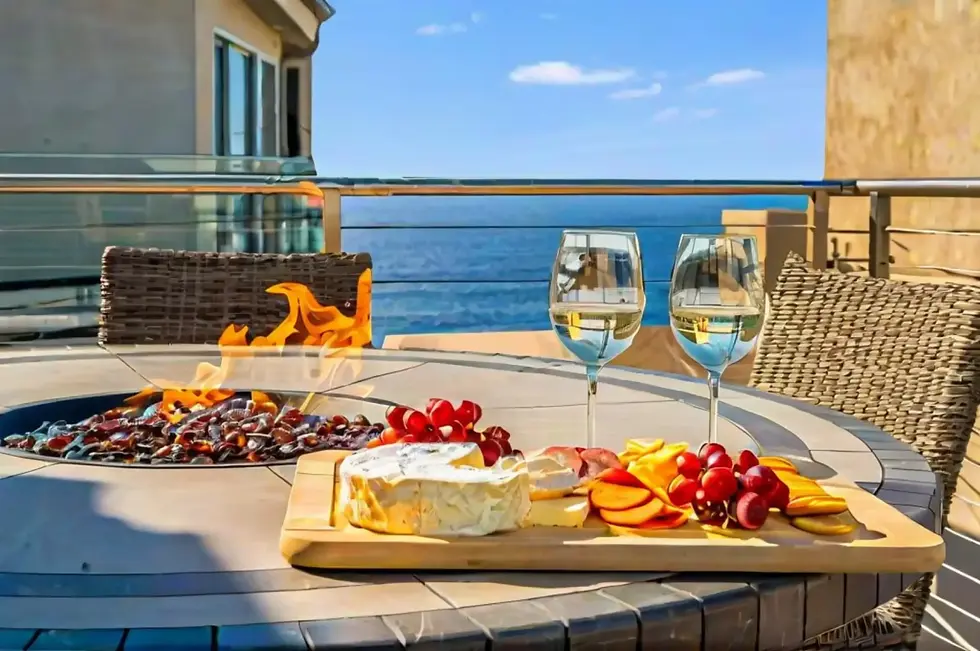 Luxury waterfront patio with fire pit and ocean views in Mission Beach CA vacation rental featuring entertaining setup