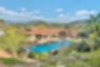 Mid-century modern California home with resort-style swimming pool and mountain views, relevant to San Diego property