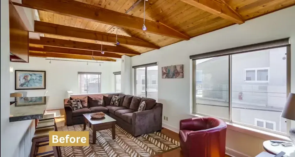 Spacious San Diego rental living room with exposed beams and sectional sofa for property management comparison
