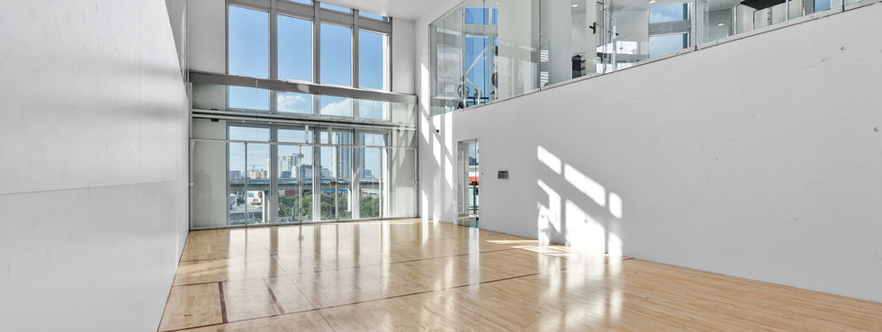 Wind Brickell racquetball court hardwood floor glass walls