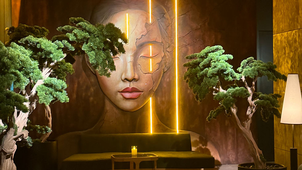 Yamashiro Miami interior lounge featuring Japanese-inspired design with bonsai trees and illuminated Buddha mural