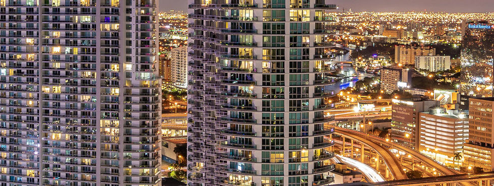 Wind Brickell condo tower aerial view at night Miami skyline