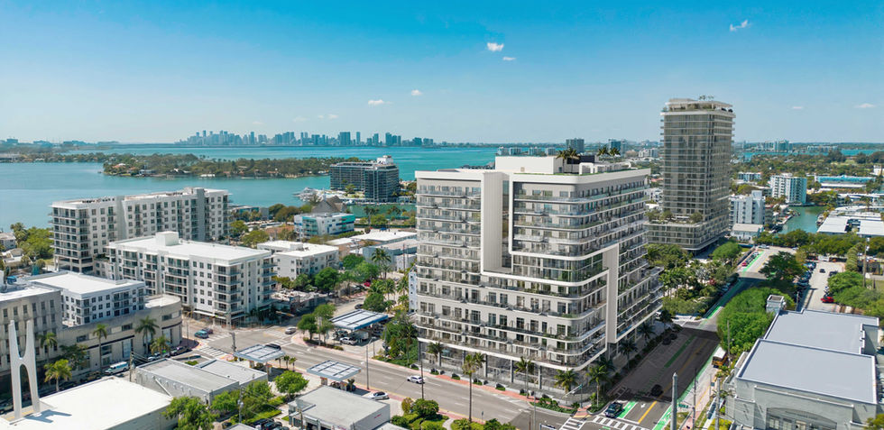 Aerial view of North Beach Miami Beach neighborhood with Biscayne Bay and Miami skyline in background