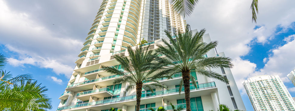 Wind Brickell tower exterior street view palm trees Miami