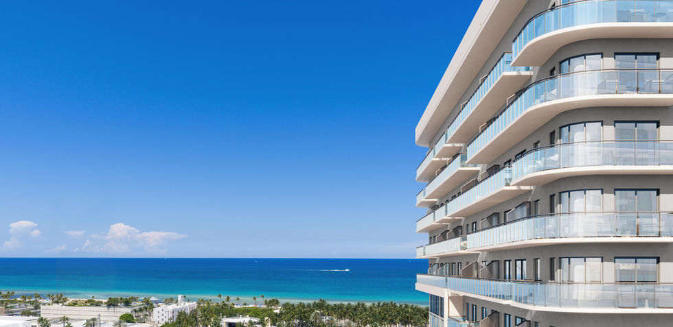 Upper-floor residences at NoBe PARC Miami Beach with ocean views and curved balcony architecture
