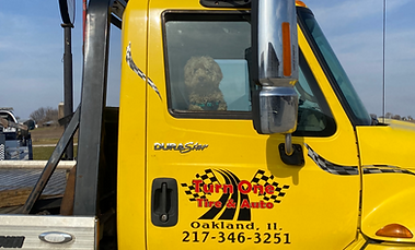 Turn One Tire & Auto Tow Truck with Dog in Passenger Seat