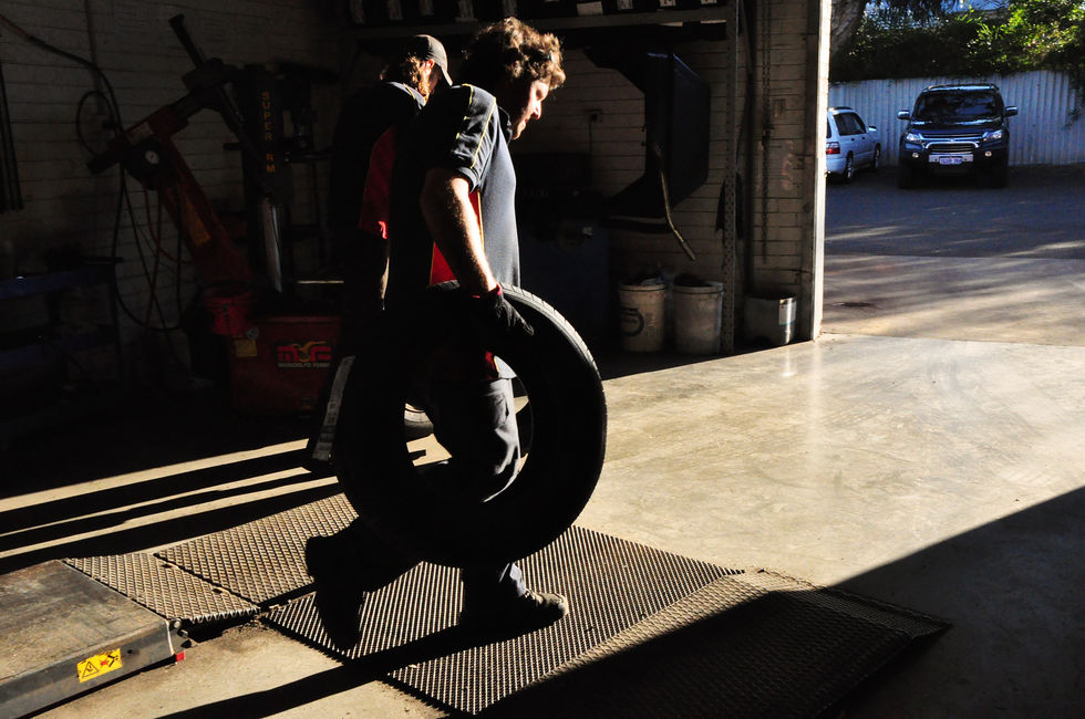 Photojournalism - Men with Tyres.jpg