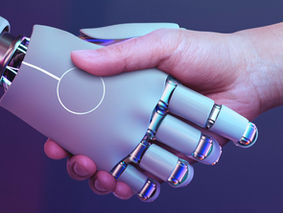 A robot shaking hands with a human