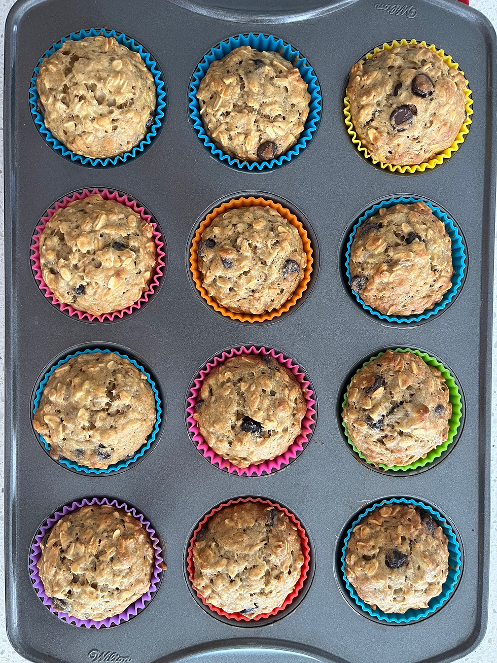 Close-up view of freshly baked banana oatmeal muffins on a rustic wooden table