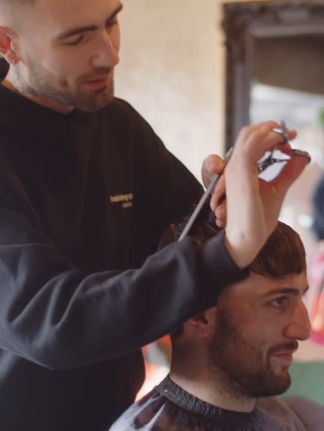DJB barber cutting a client’s hair during a DJB appointment