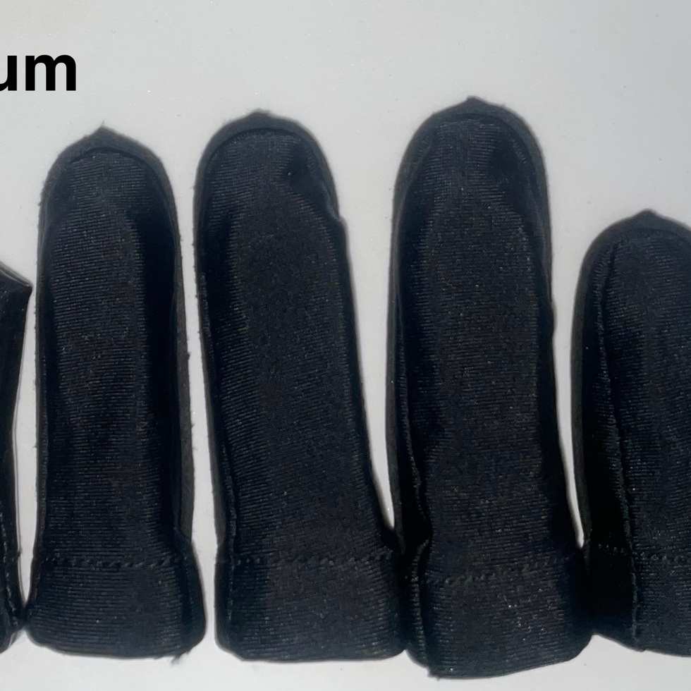 Medium black Finger Jackets in line. Thumb on the left, pinky on the right. A ruler is on the side showing size in inches.