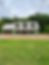 Classic Cape Cod house under construction with dormers.