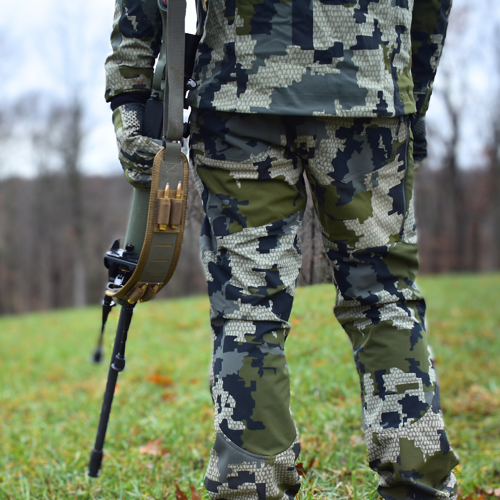 person holding Green and brown precision rifle sling with attached shell holders