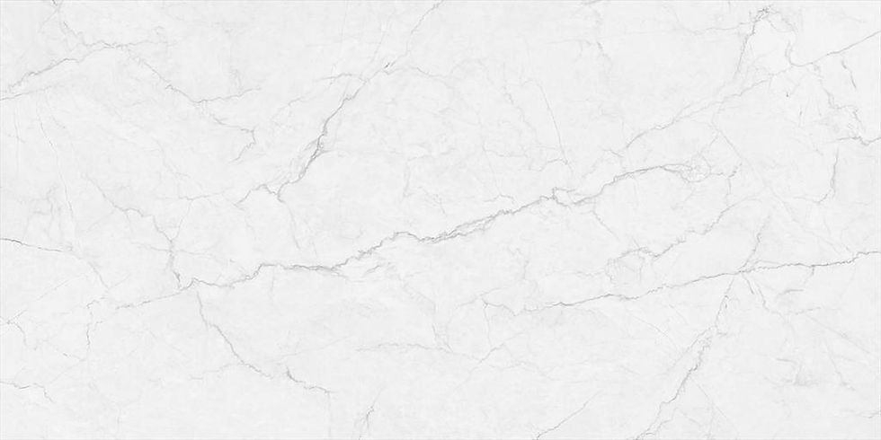 UniCeramica Supreme porcelain stone surface with a soft white base with delicate pale-grey marble-style movement