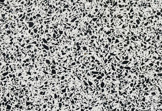 COMPAC Classic Montblanc engineered stone surface with a clean white terrazzo-style base with bold black mineral chips