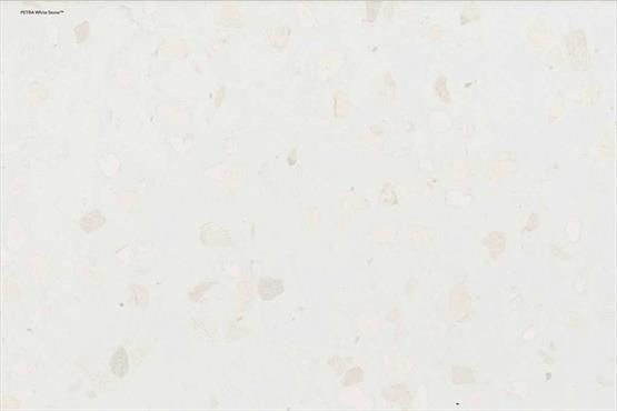 COMPAC Petra Botticino engineered stone surface with a warm pale base with soft white and beige aggregate fragments