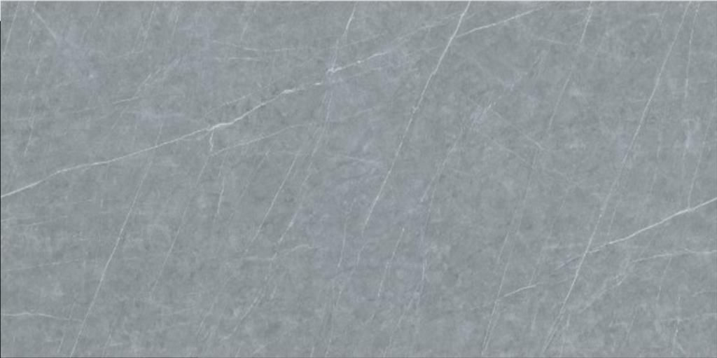 UniCeramica Grigio porcelain stone surface with a soft pale-grey surface with subtle cloudy mineral texture