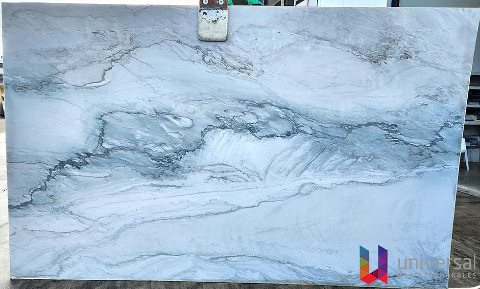 Statuario Quartzite Deluxe light white and pale blue-grey quartzite slab with soft charcoal veining.