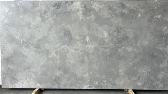 UniQuartz Concrete Storm Light engineered stone surface with a pale concrete-grey base with soft, clouded tonal variation