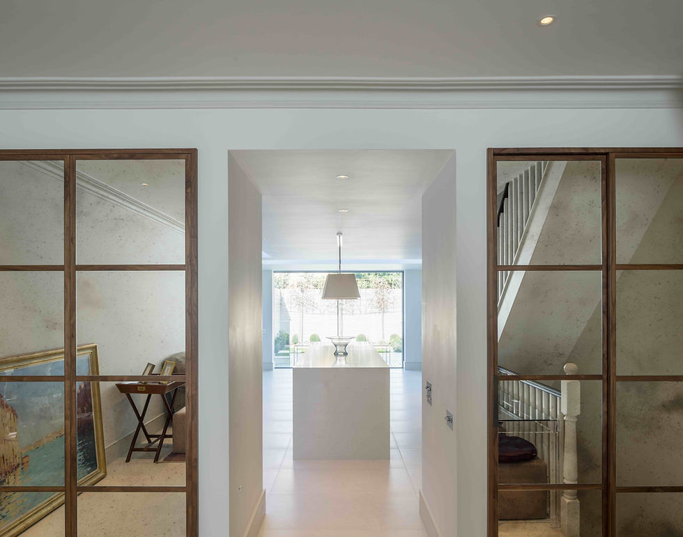 Albion Custom Home Design with custom interior frames leading to the kitchen.