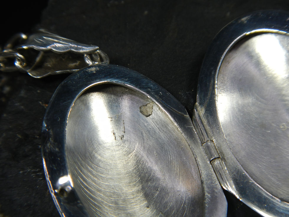 Thumbnail: Beautiful Vintage Sterling Silver Oval Floral Design Carved Locket