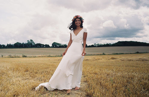 Maple wedding dress featuring a plunge bodice with a subtle wrap, feminine capped sleeves, and a low scooped back, perfect for a relaxed yet classic bridal look