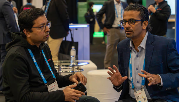 Members of the TCS team discuss business at Adobe Summit in Las Vegas