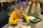 Child at previous fall workshop making crafts