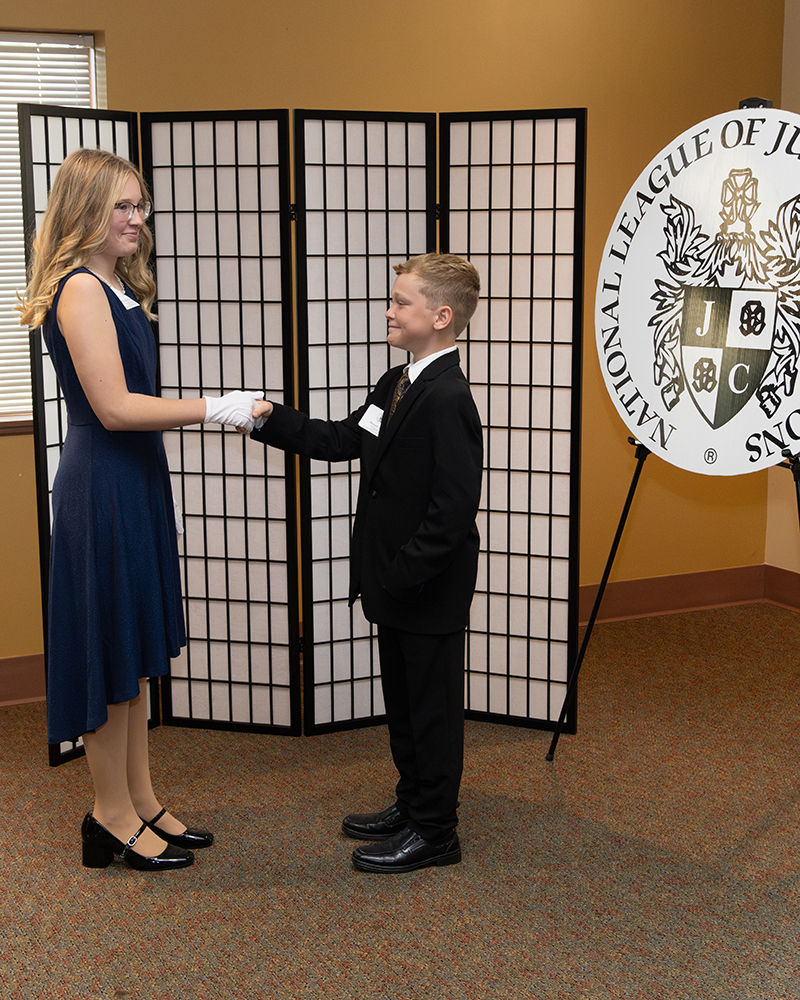 Lady & Gentlemen Students Shaking Hands