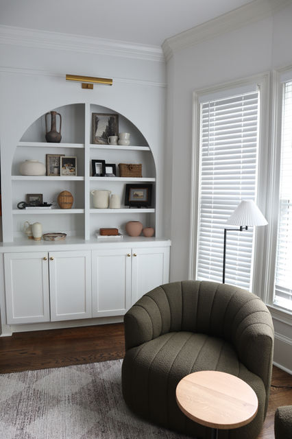 Project Griffin Haven project with neutral and airy feel with arched built-in bookcases.