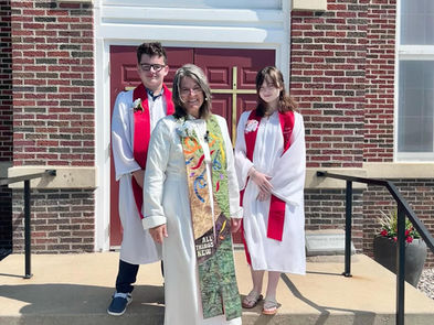 Dylan, Pastor Kim, and Izzy on the front steps of Immanuel UCC Wright City MO